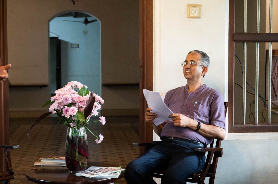 A person sitting in a chair holding a paper

AI-generated content may be incorrect.