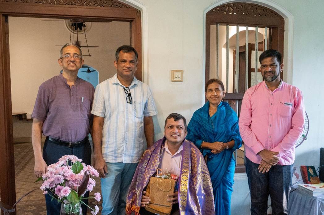 A group of people standing in front of a door

AI-generated content may be incorrect.